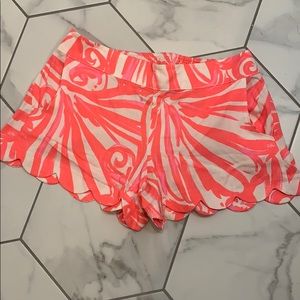 Bright pink/coral pull on scalloped shorts
